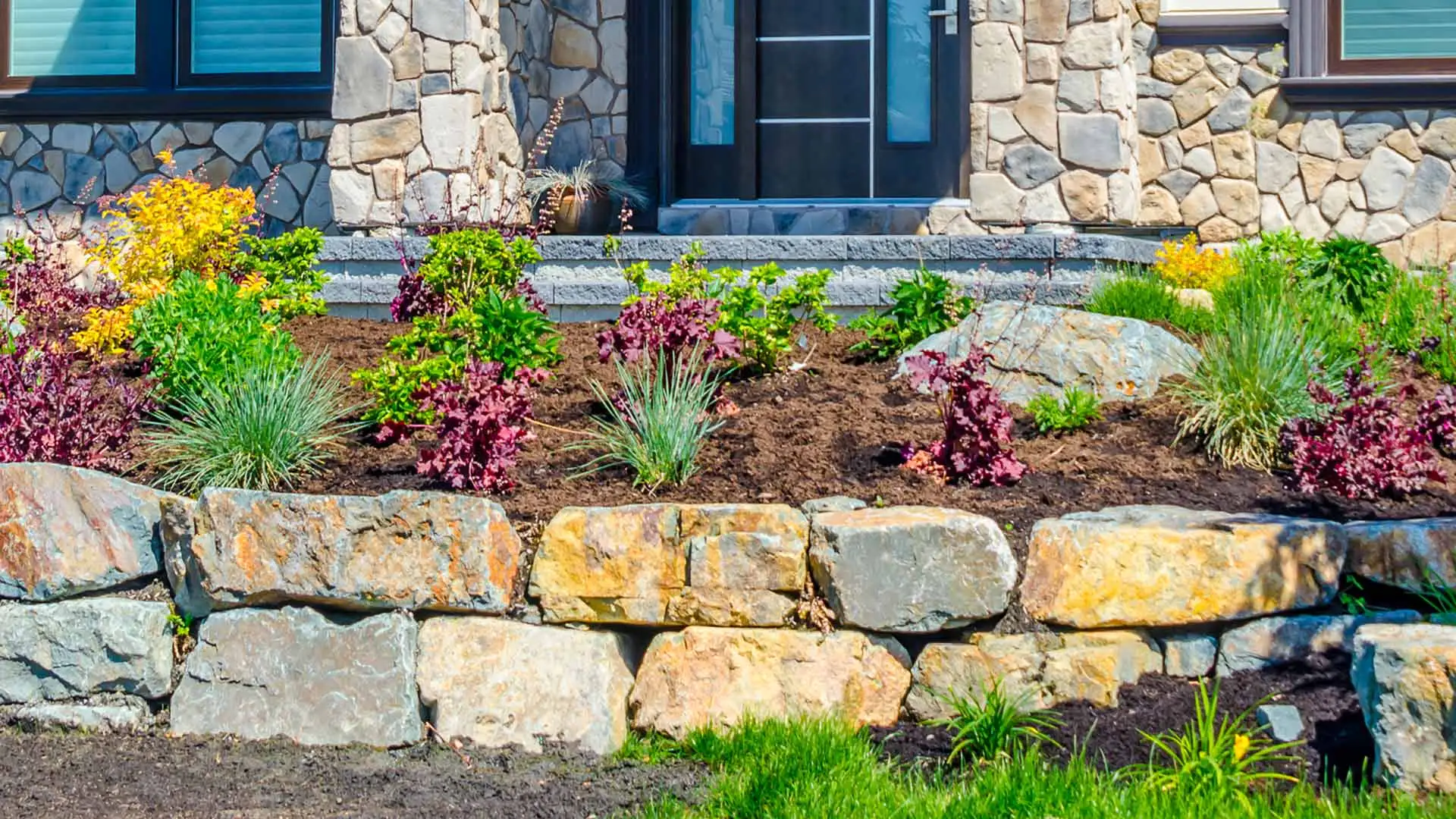 Beautiful landscape bed in the front yard of a home near Madison, OH.