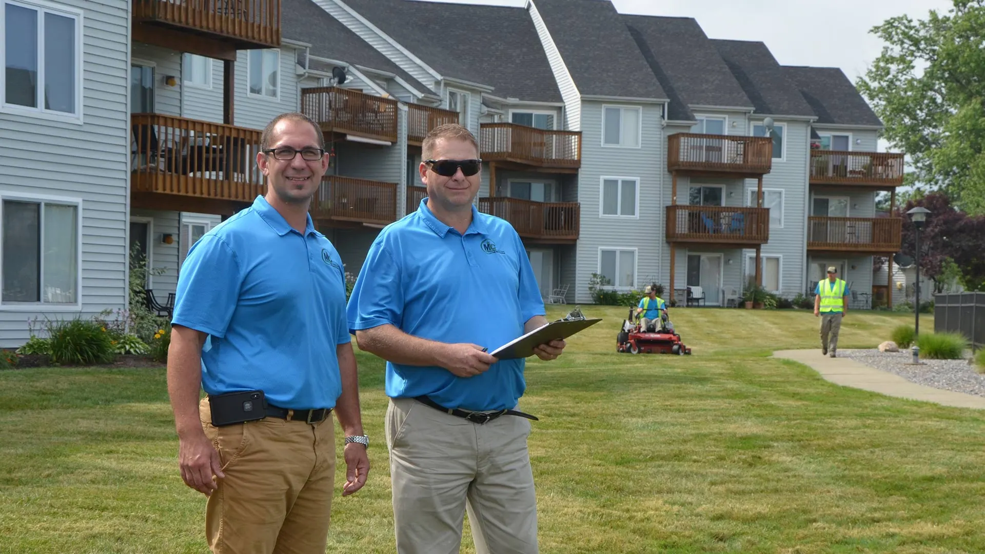 MC Professional Lawn Care and Snow Plowing specialists and managers at a customer's property near Madison, OH.