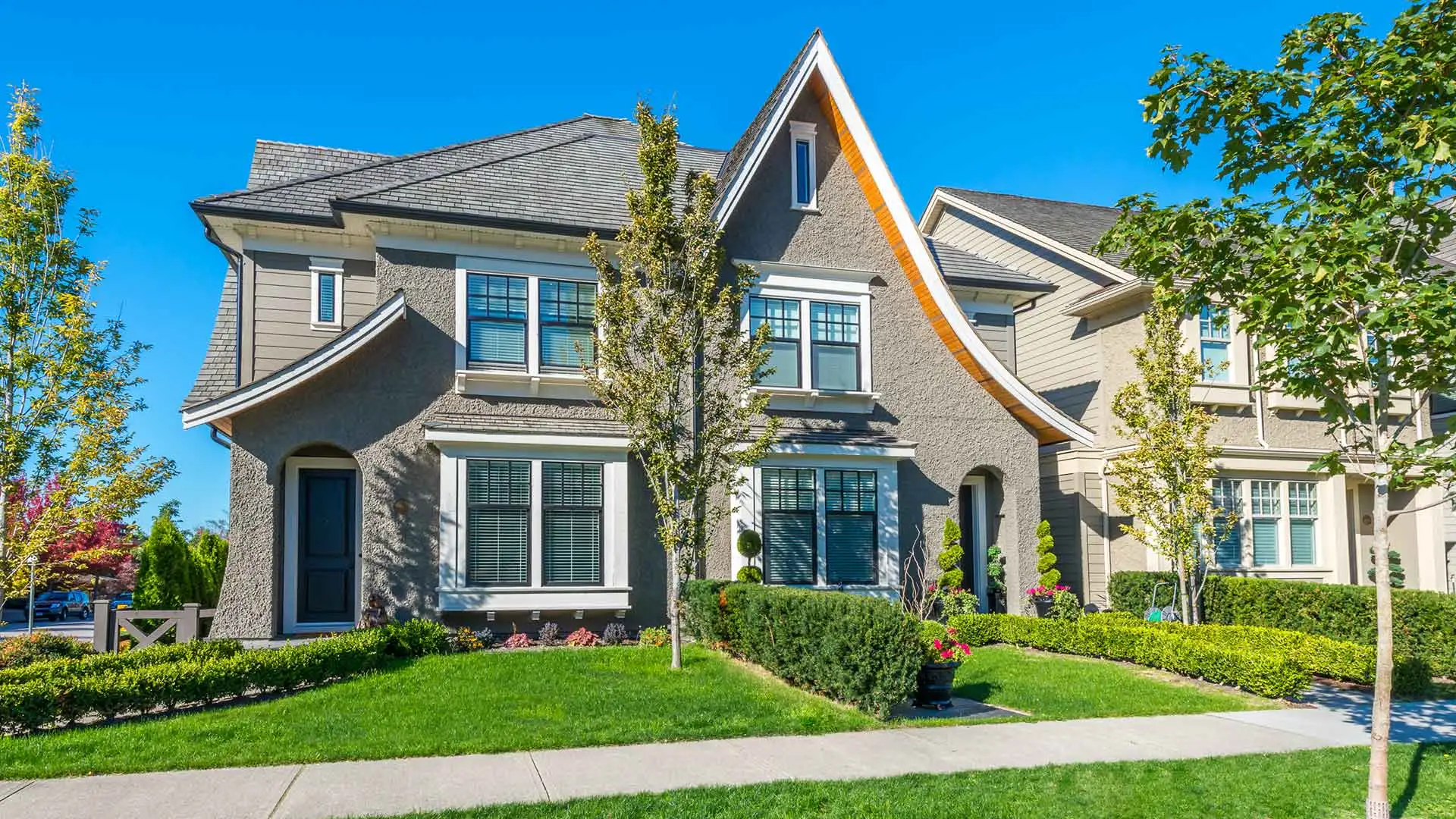 A beautiful home with a healthy lawn and new shrubs in Painesville, OH.