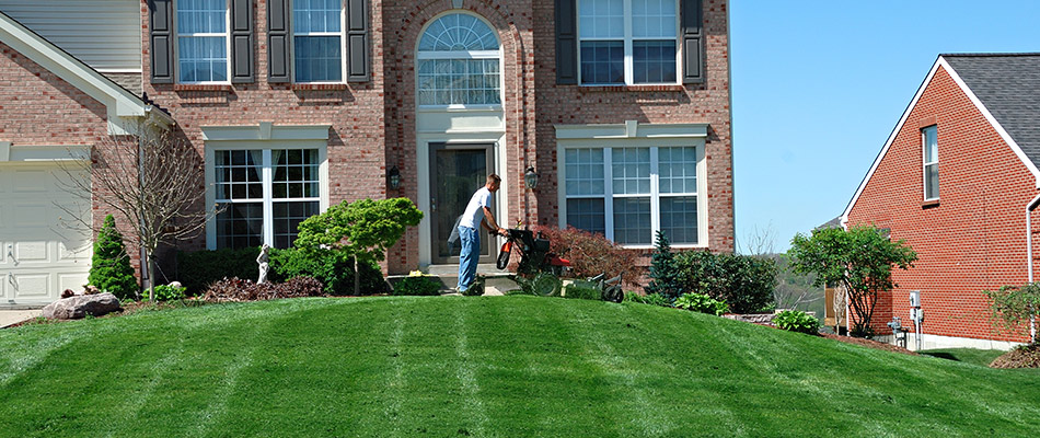 Lawn mowing expert cutting a lawn near Madison, OH.