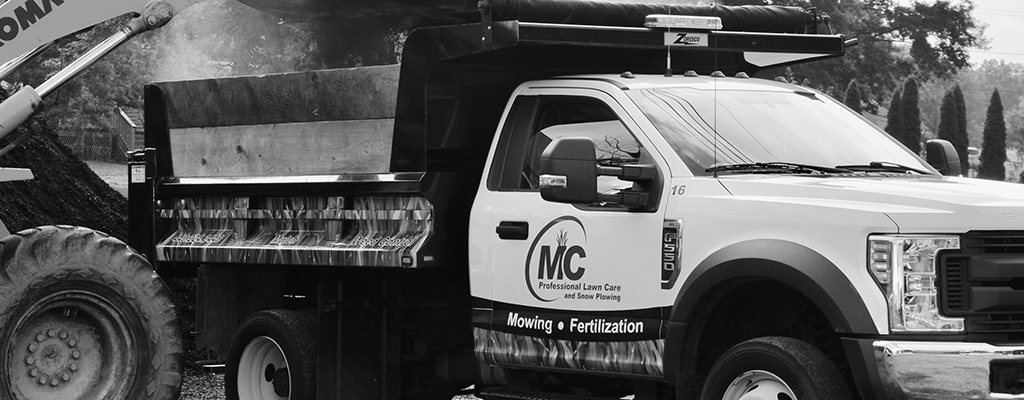A MC Professional Lawn Care and Snow Plowing truck being loaded with dirt from a job in and around Madison, OH.