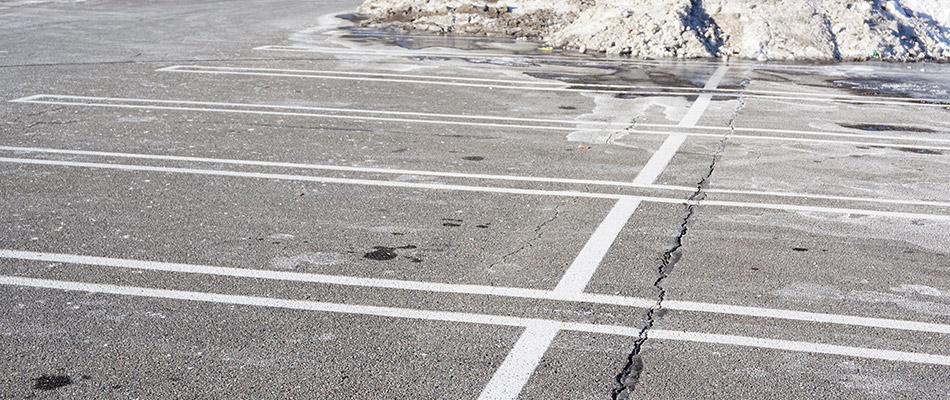 Commercial parking lot covered with salt and without ice near Madison, OH.