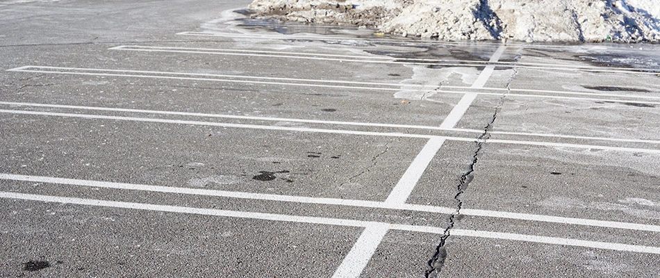 Commercial parking lot covered with salt and without ice near Madison, OH.