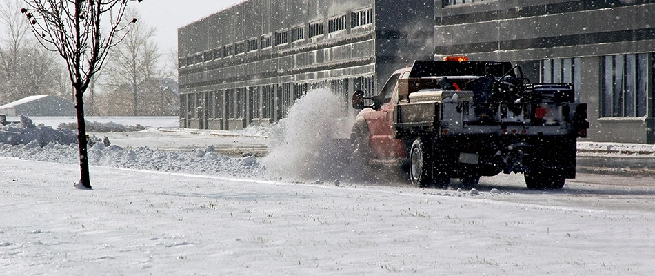 Snow plowing truck at the start of a snow fall near Madison, OH.